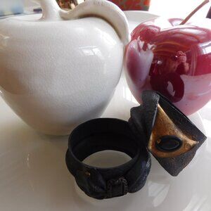 2 brown and gold leather bracelets made by a craftswoman New